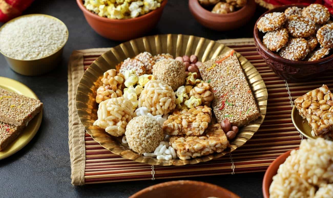 Traditional Lohri rituals with til, jaggery and groundnuts offered to the fire