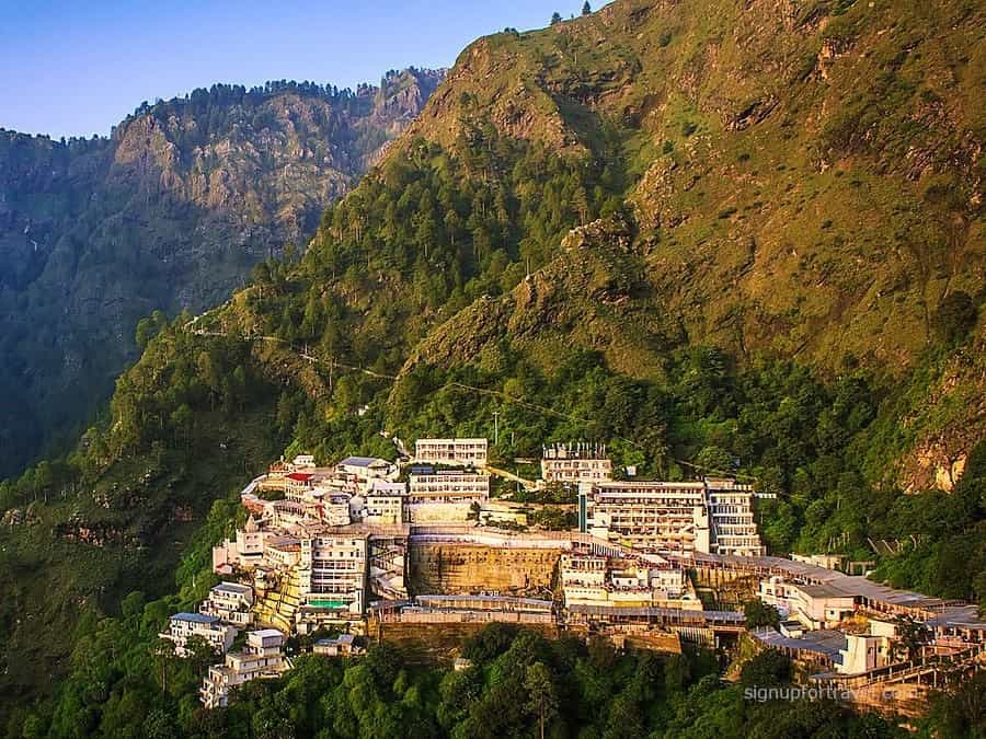 Bhairav Nath Temple on Trikuta Mountains near Vaishno Devi shrine with mountain peaks and pilgrim path
